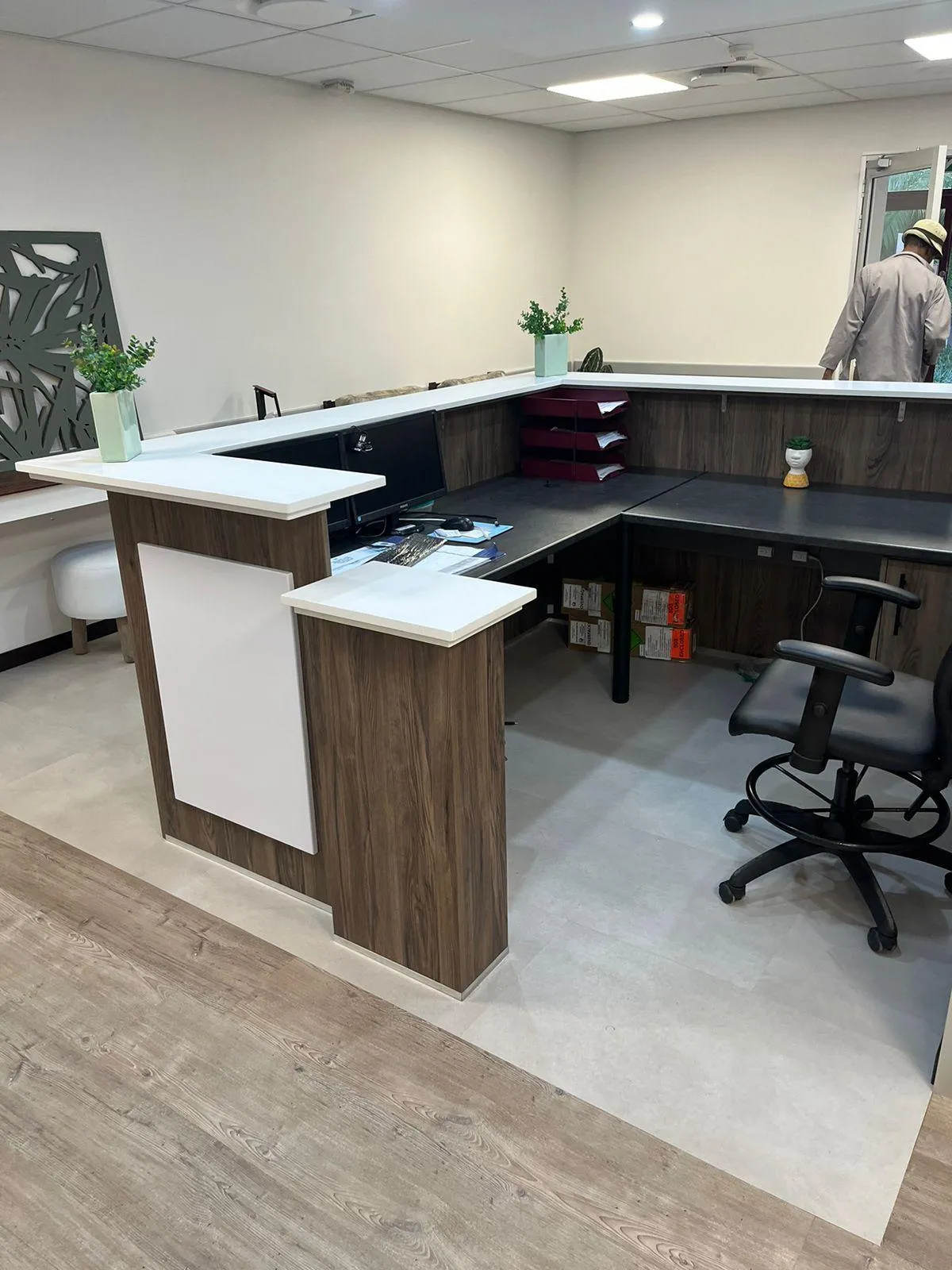 Wooden minimalist office desk with custom cabinetry.