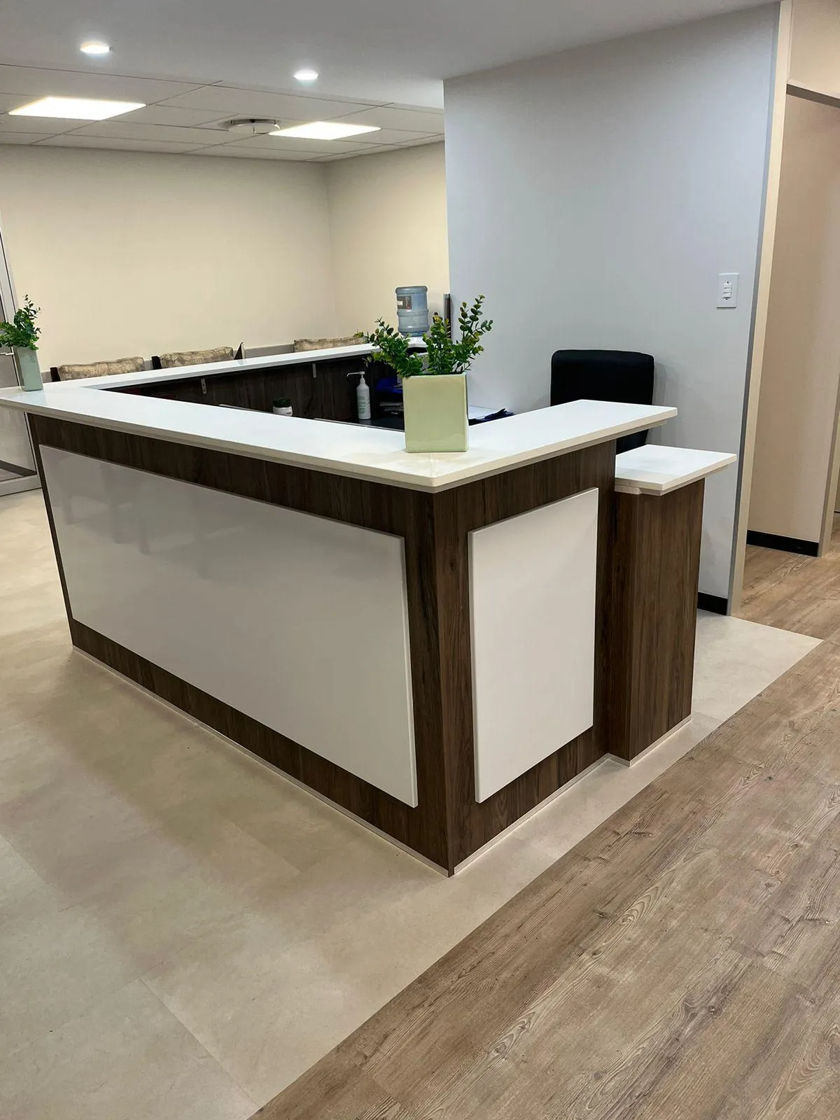 Wooden minimalist office desk with custom cabinetry.