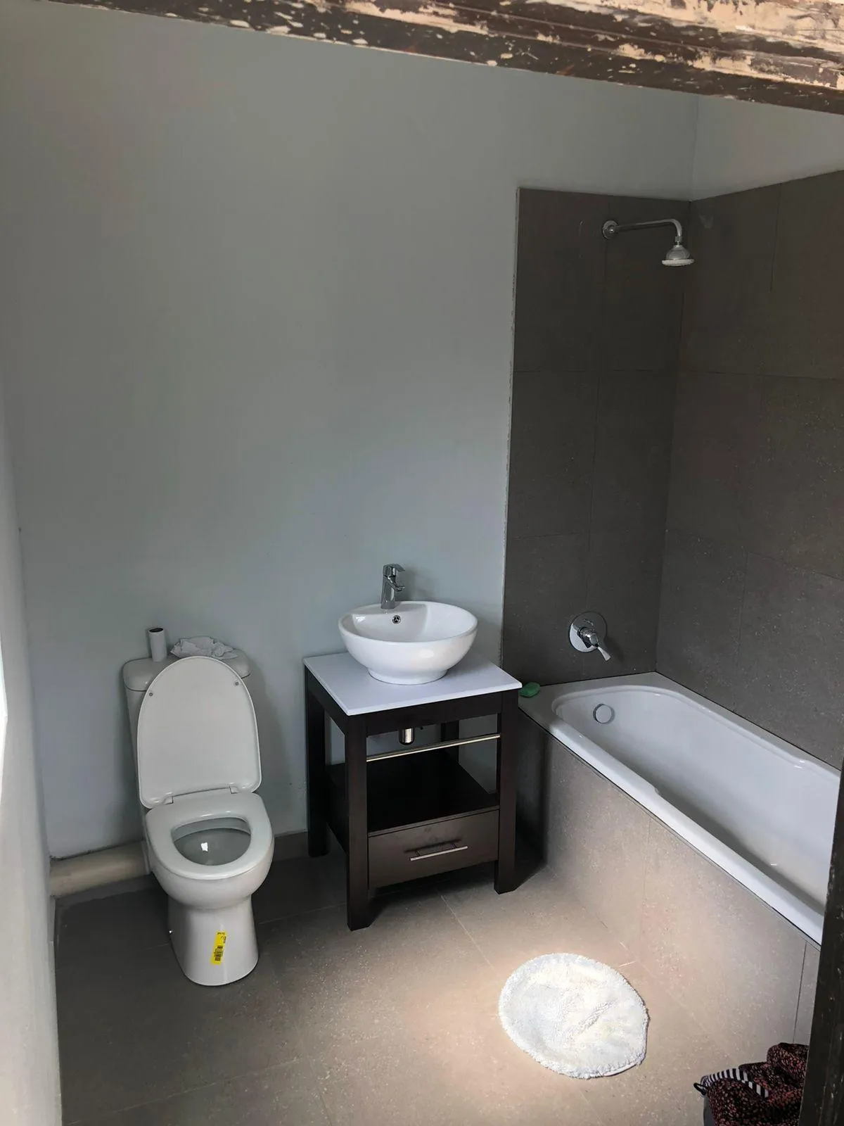 Minimalist bathroom stand design featuring a see through body and a single door finish.