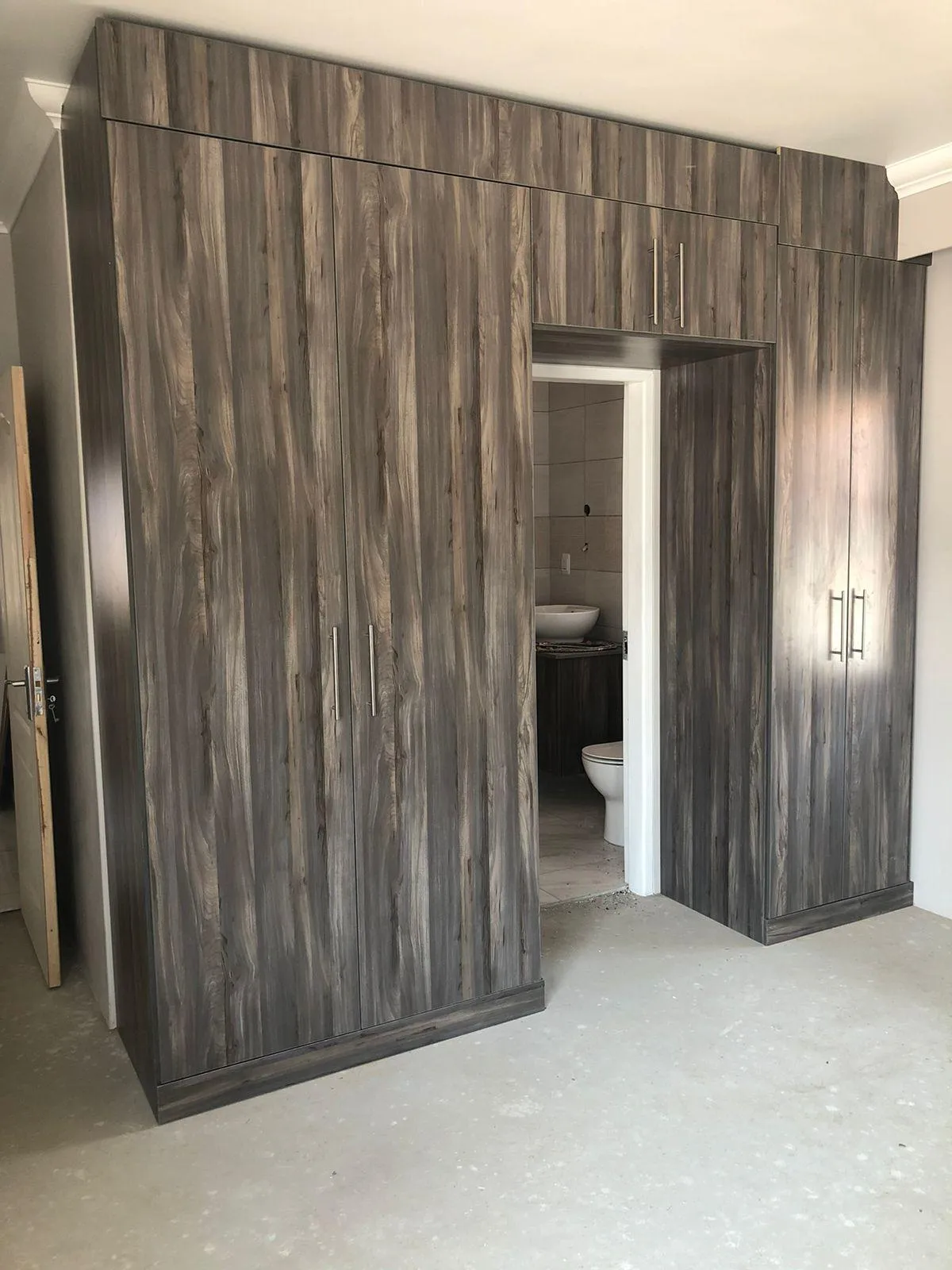 DIY walk-in closet with custom shelving and hanging space