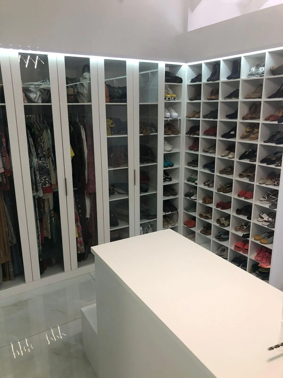 Spacious custom wardrobe with chest drawer, mirrors, shoe storage and hanging space