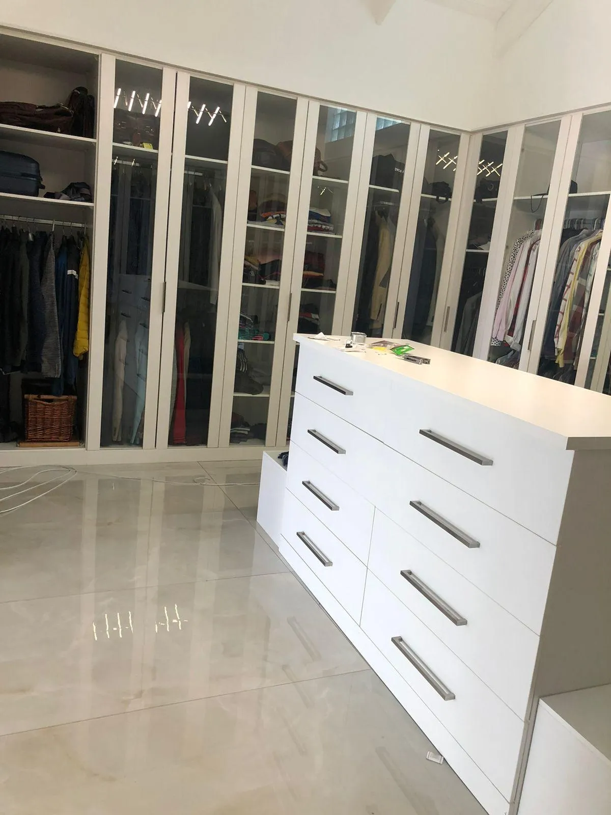 Spacious custom wardrobe with chest drawer, mirrors, shoe storage and hanging space