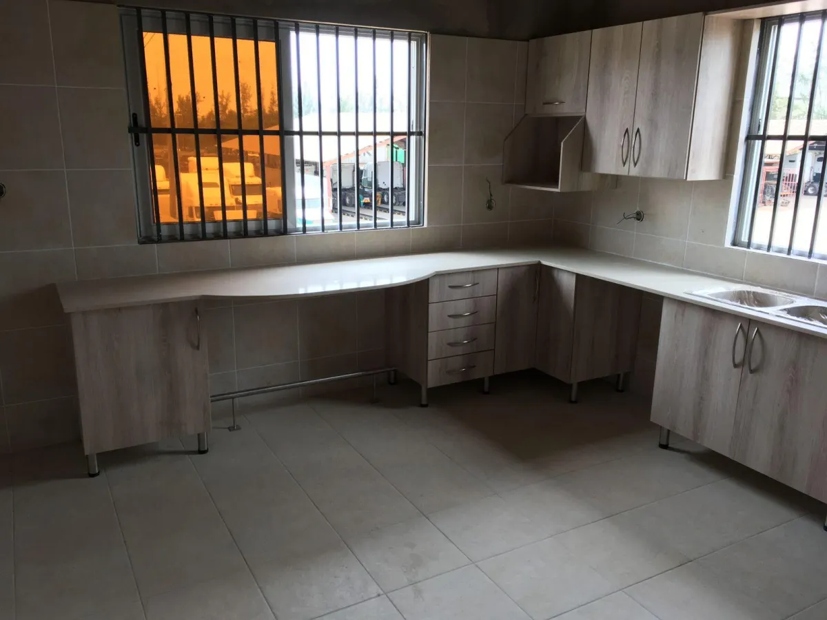 Kitchen units with built-in stove and microwave space.