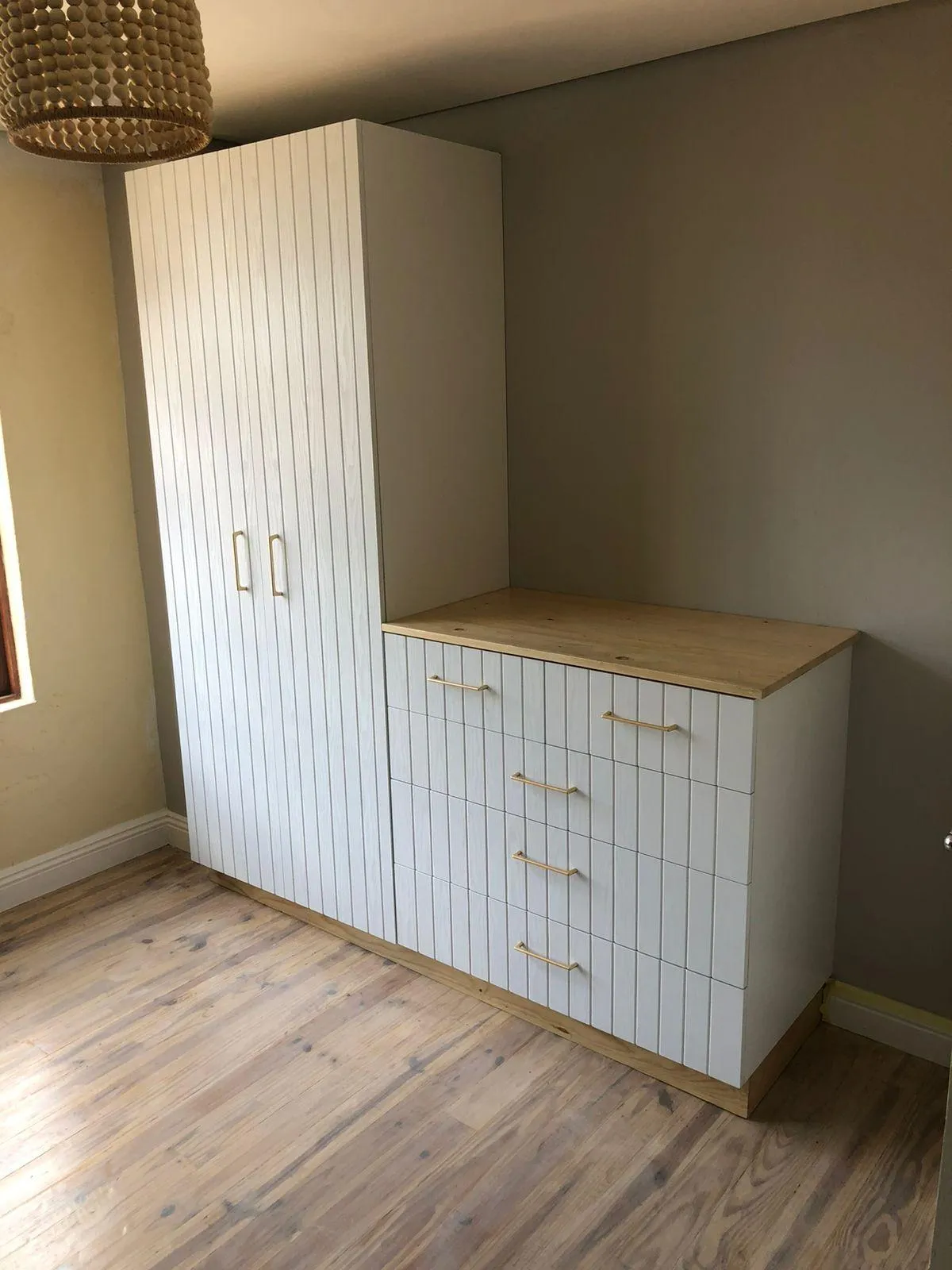 White bedroom cupboard with design from the 90s