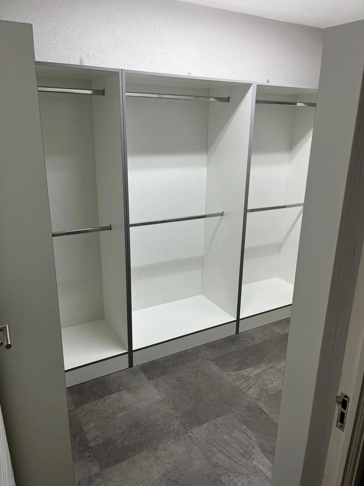 White melamine bedroom cupboard with minimalist shelving