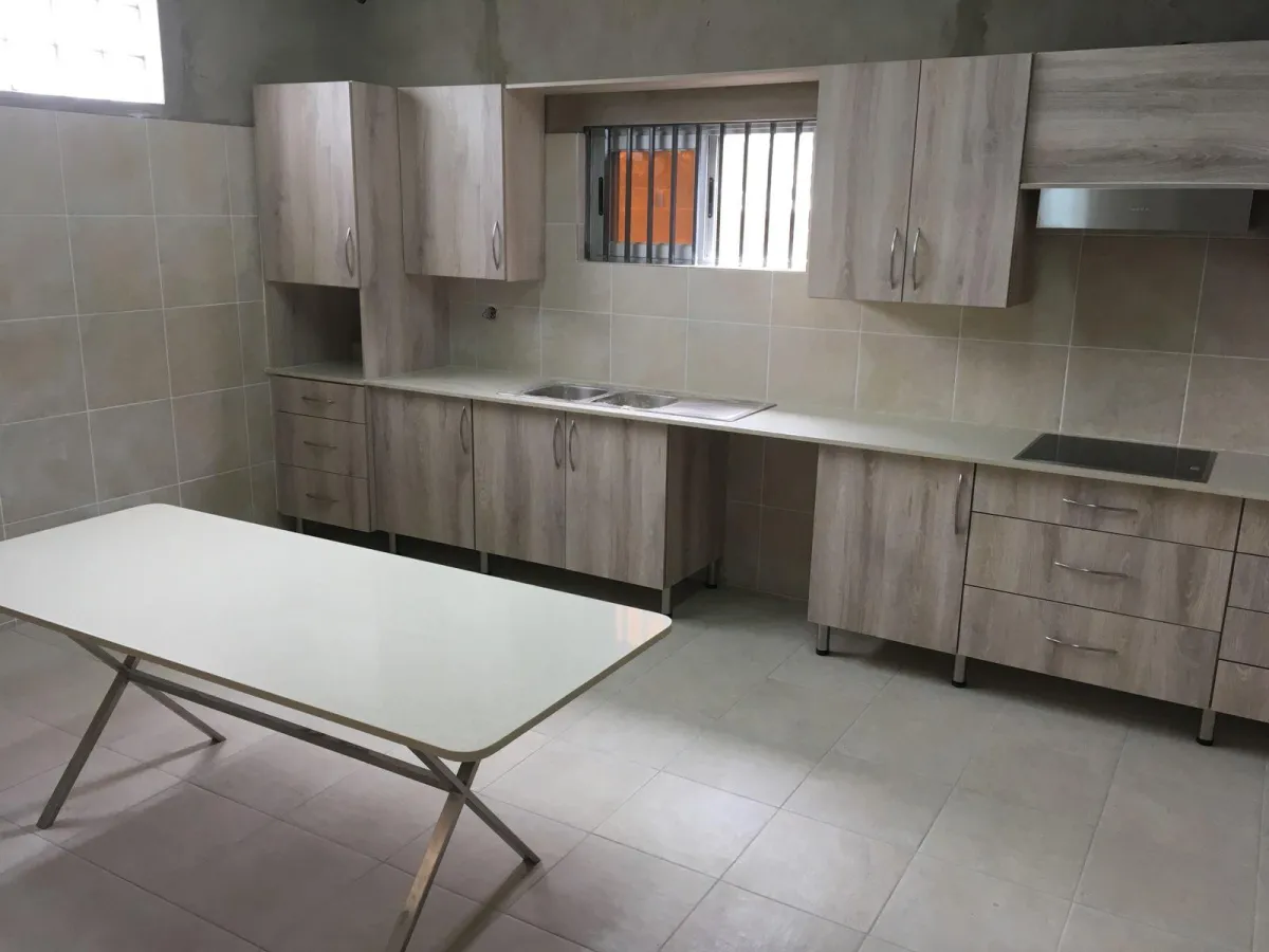 Modern kitchen units with built-in stove and microwave space.