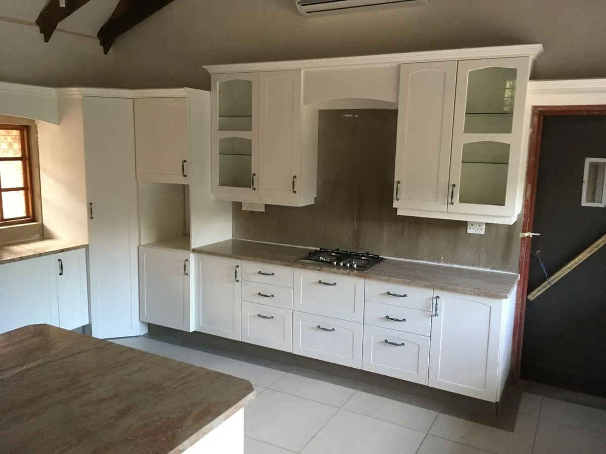 Built-in kitchen cabinetry with glass doors.