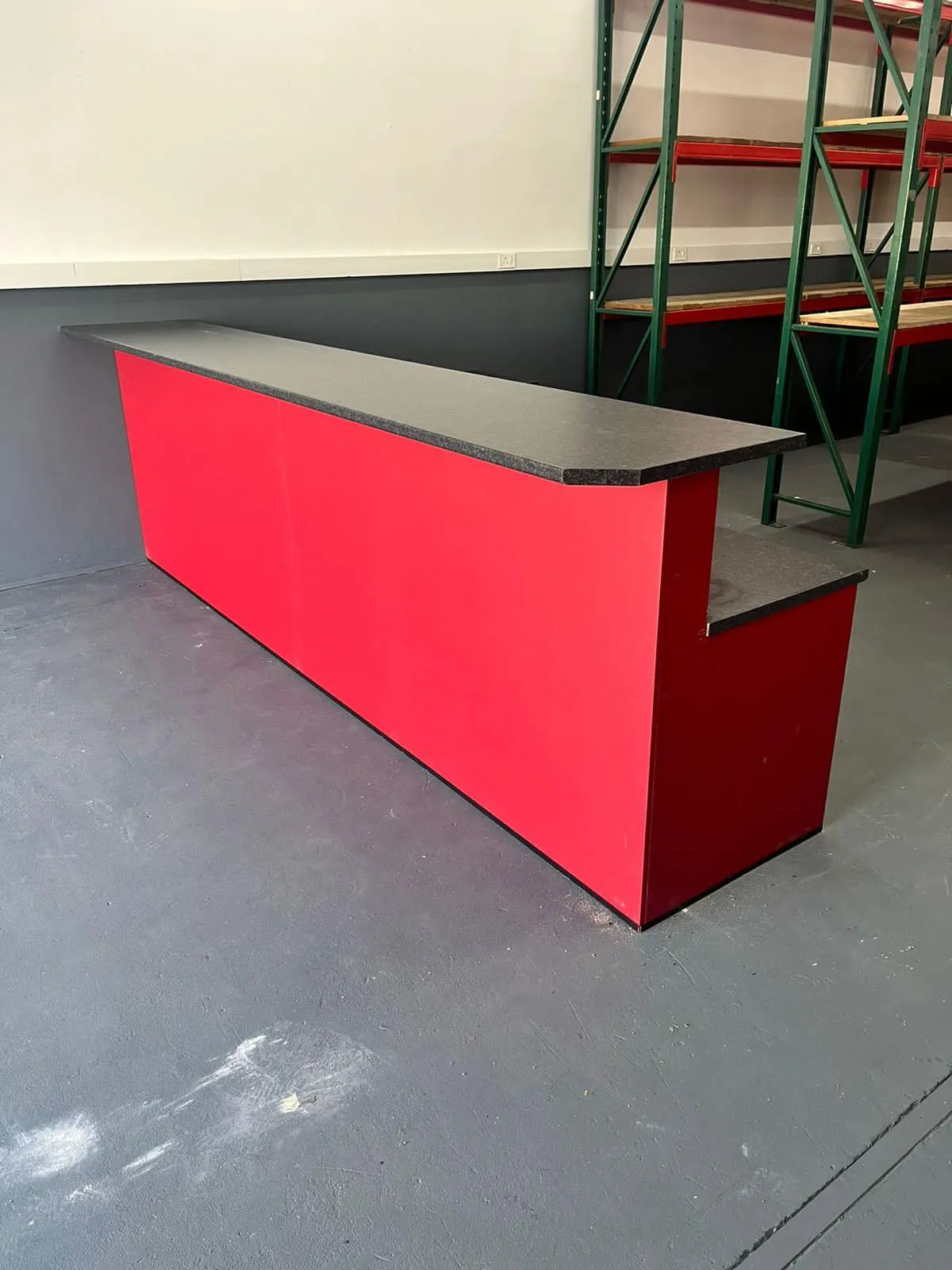 Modular office cupboard units with light red finish..