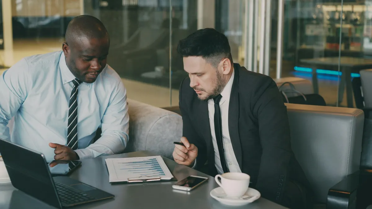 Financial advisor discussing debt consolidation mortgage solutions.