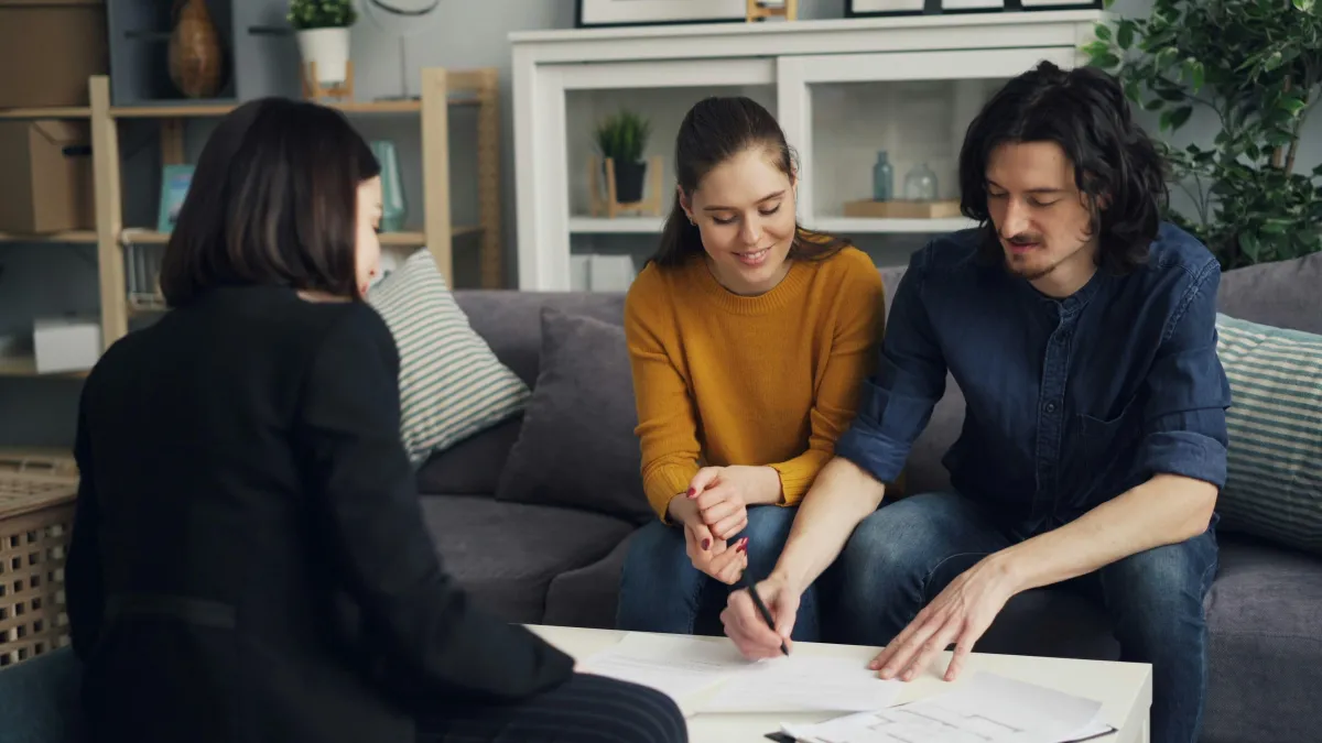 Mortgage renewal consultation between client and financial advisor.