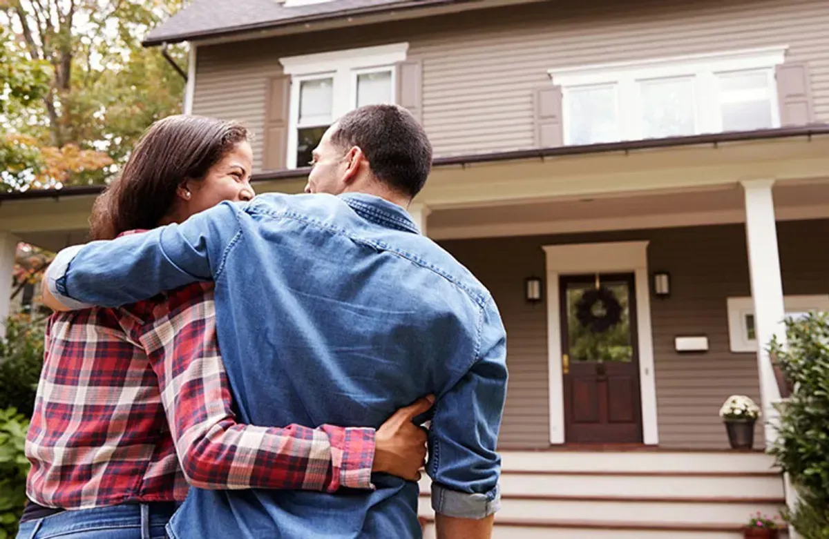 First-time homebuyer reviewing mortgage documents with an advisor.
