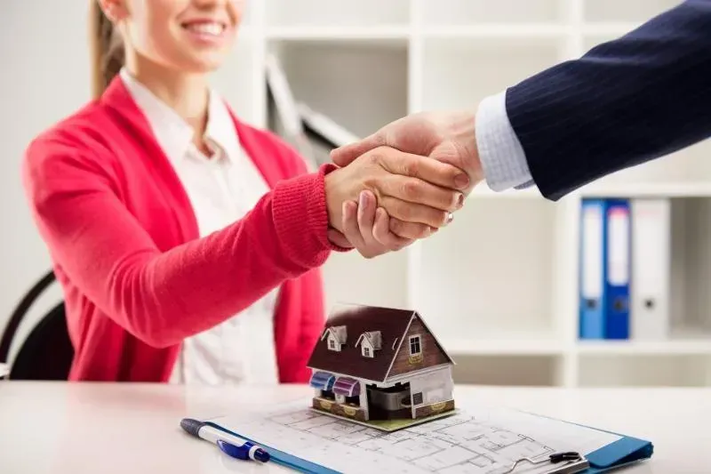 Financial advisor helping a homeowner consolidate debt through mortgage refinancing.