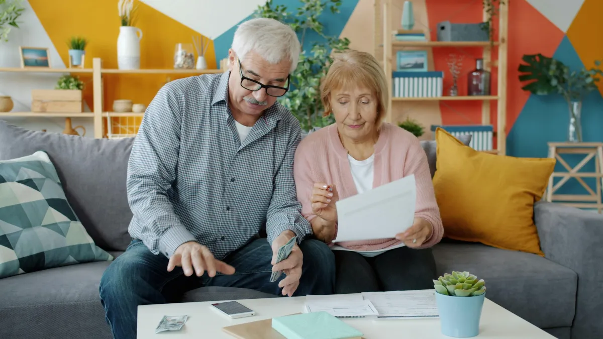 Homeowner discussing second mortgage financing with a mortgage broker.