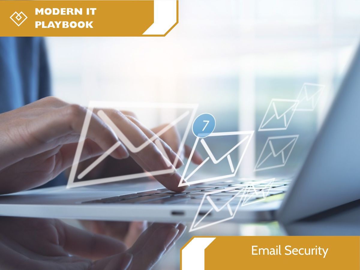 A close-up photograph features hands typing on a laptop keyboard, with stylized digital email icons in motion. One prominent mail icon displays a blue "7" notification bubble, indicating unread messages, with trails of other semi-transparent envelopes. The image includes branding, with a top-left mustard-yellow banner containing the white text "MODERN IT PLAYBOOK" and a stylized diamond logo. A matching mustard-yellow banner is positioned at the bottom-right corner with the white text "Email Security". The background is a gently blurred, bright office environment.