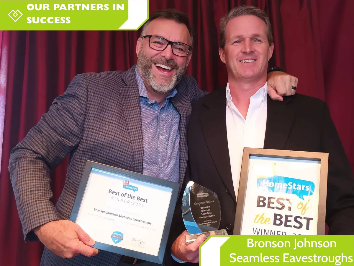 Mike Courneya of Bronson Johnson Seamless Eavestroughs holding HomeStars Best of the Best awards alongside a partner, with “Our Partners in Success” branding.