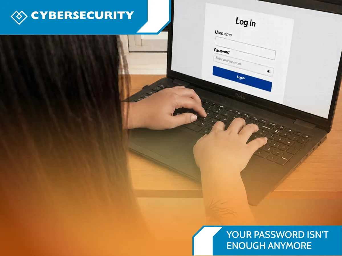 Person signing in on a laptop, illustrating cybersecurity and password protection.