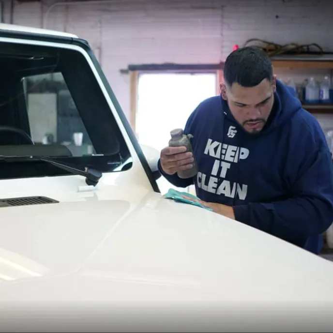 Technician applying a ceramic coating