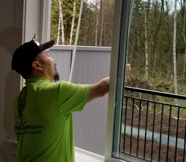 Screenguy Sam installing a sliding window screen for a townhome in maple ridge