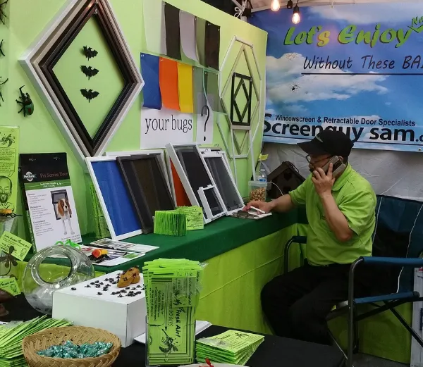 Screenguy Sam answering phone call during maple ridge homeshow