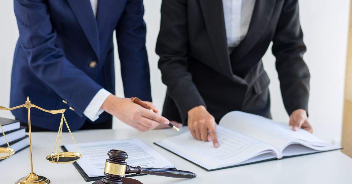 Attorneys reviewing legal intake documents