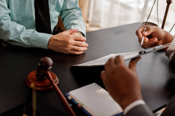 Law firm staff member on a call qualifying a prospective client inquiry.