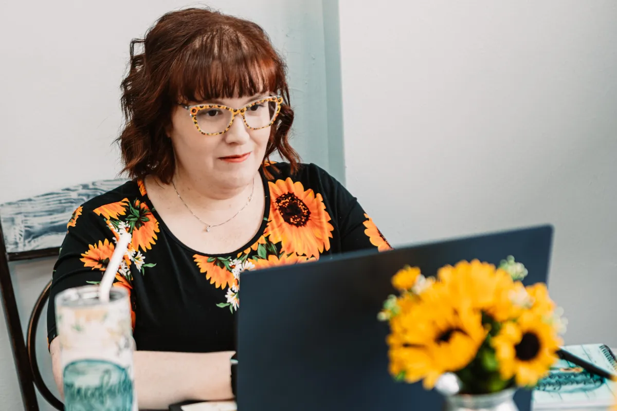 Sara Comer at her desk
