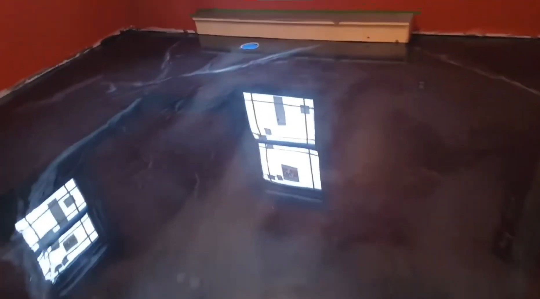 black metallic resin flooring in red house