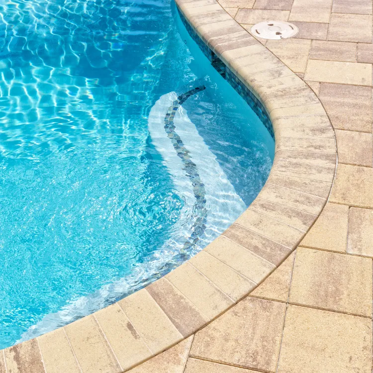 Paver pool deck with coping