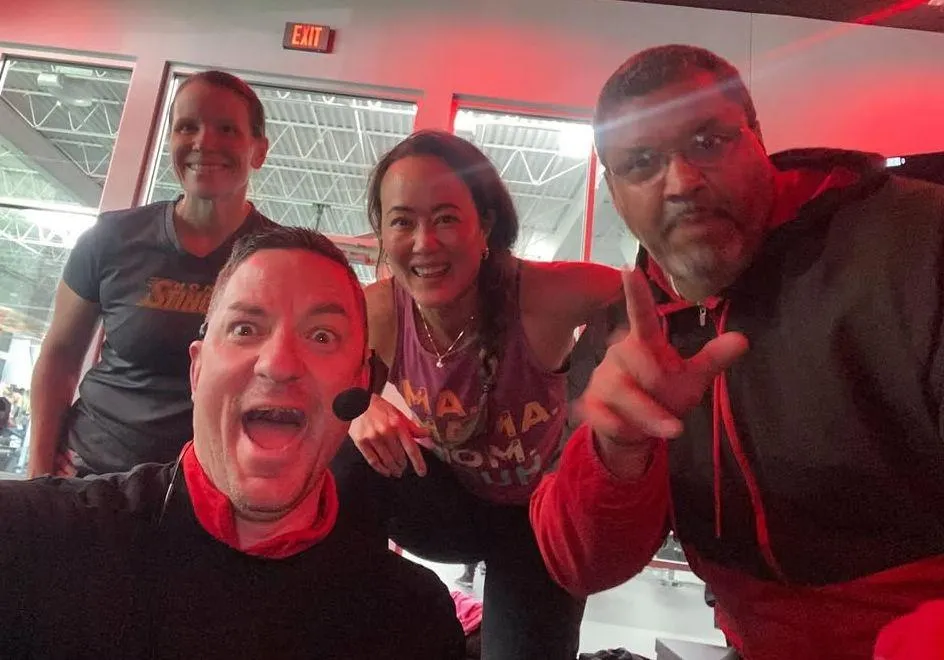 man carrying blue kettle