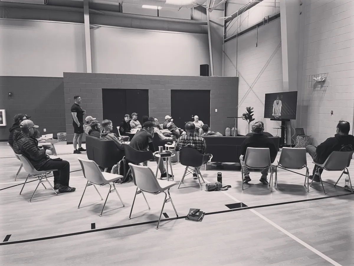 man holding incandescent bulb