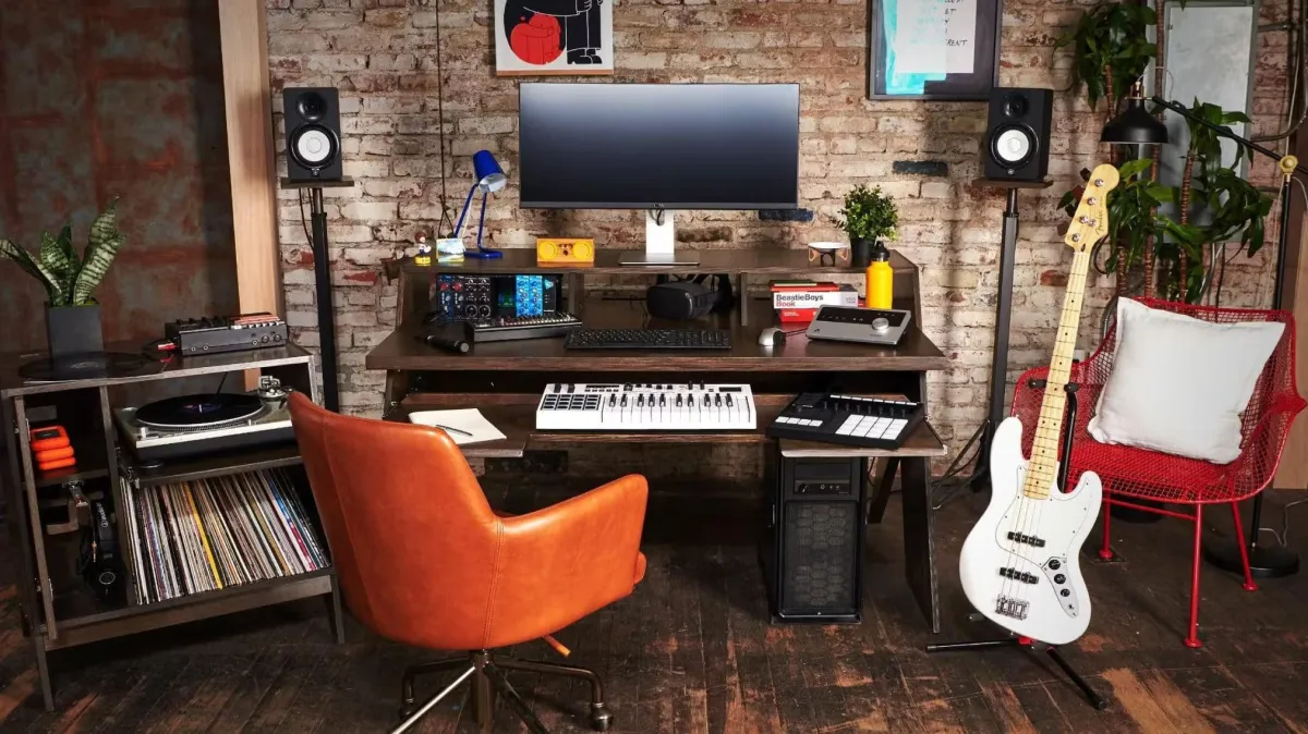 Dynamic shot of speakers and a guitar in a well-lit music studio