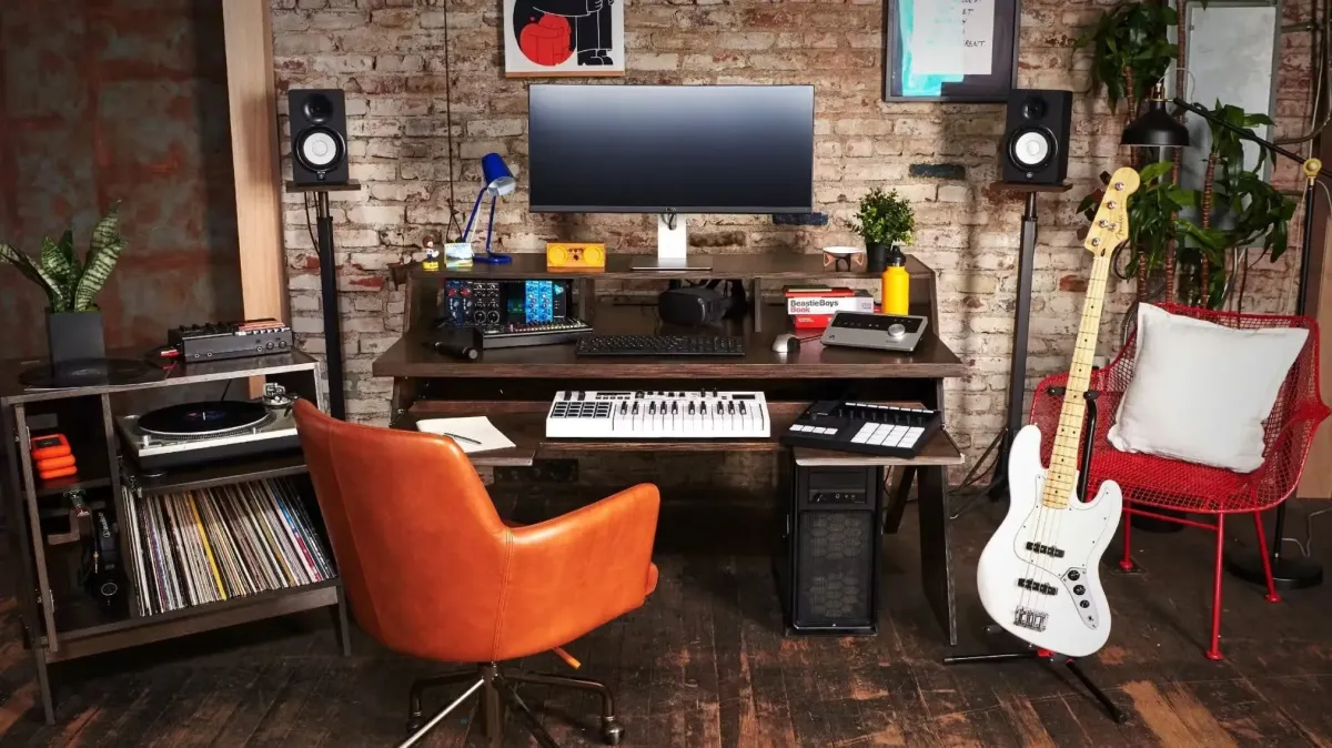 Dynamic shot of a guitar and studio monitors in a recording studio room