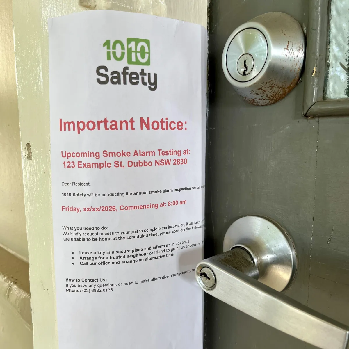 Branded 1010 Safety re-attendance notice placed on a unit door to ensure transparent strata communication.