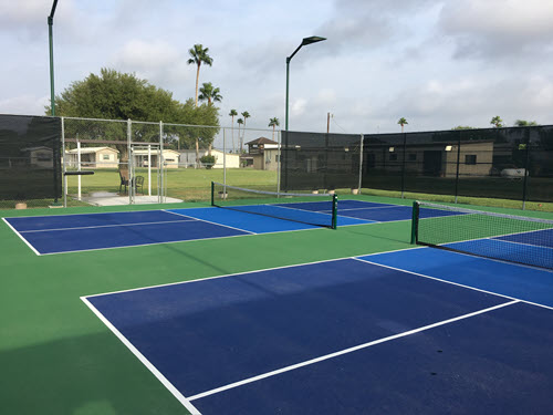 Close-up of a pickleball court surface, highlighting texture and lines
