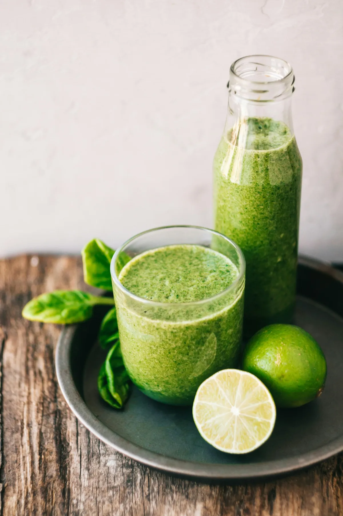 Fresh green detox smoothie with lime and herbs