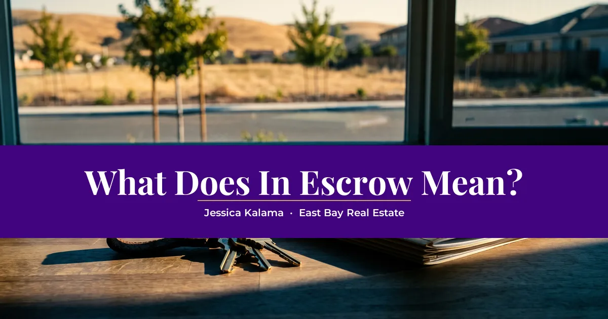 House keys and a folder of paperwork on a sunlit kitchen counter with golden hills and young trees outside the window, with the headline "What Does In Escrow Mean?"