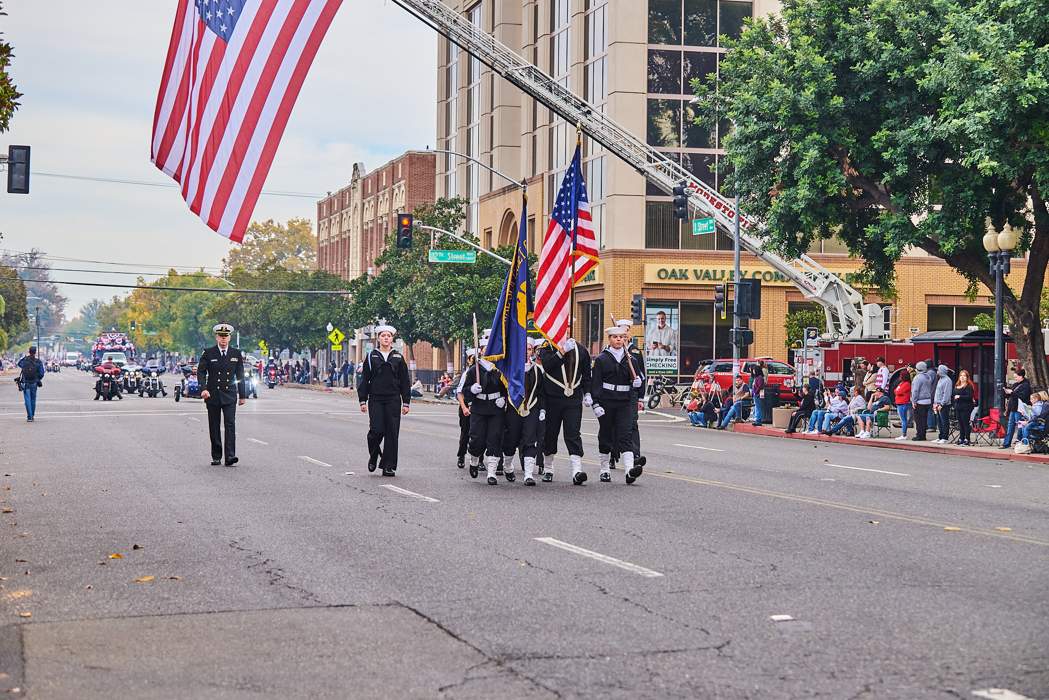 Soldiers in uniform marching in formation with rifles