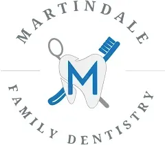 Martindale Family Dentistry circular badge logo with a central tooth containing the letter M, crossed dental tools behind it, and gray curved text around the circle.