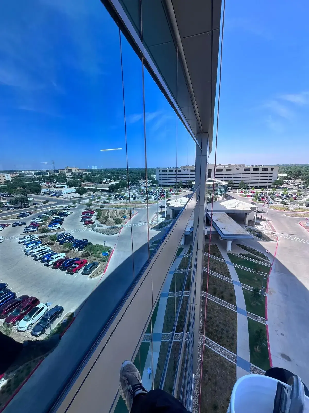 Streak-free high-rise windows with clear city view showcasing professional window cleaning results in Oklahoma City