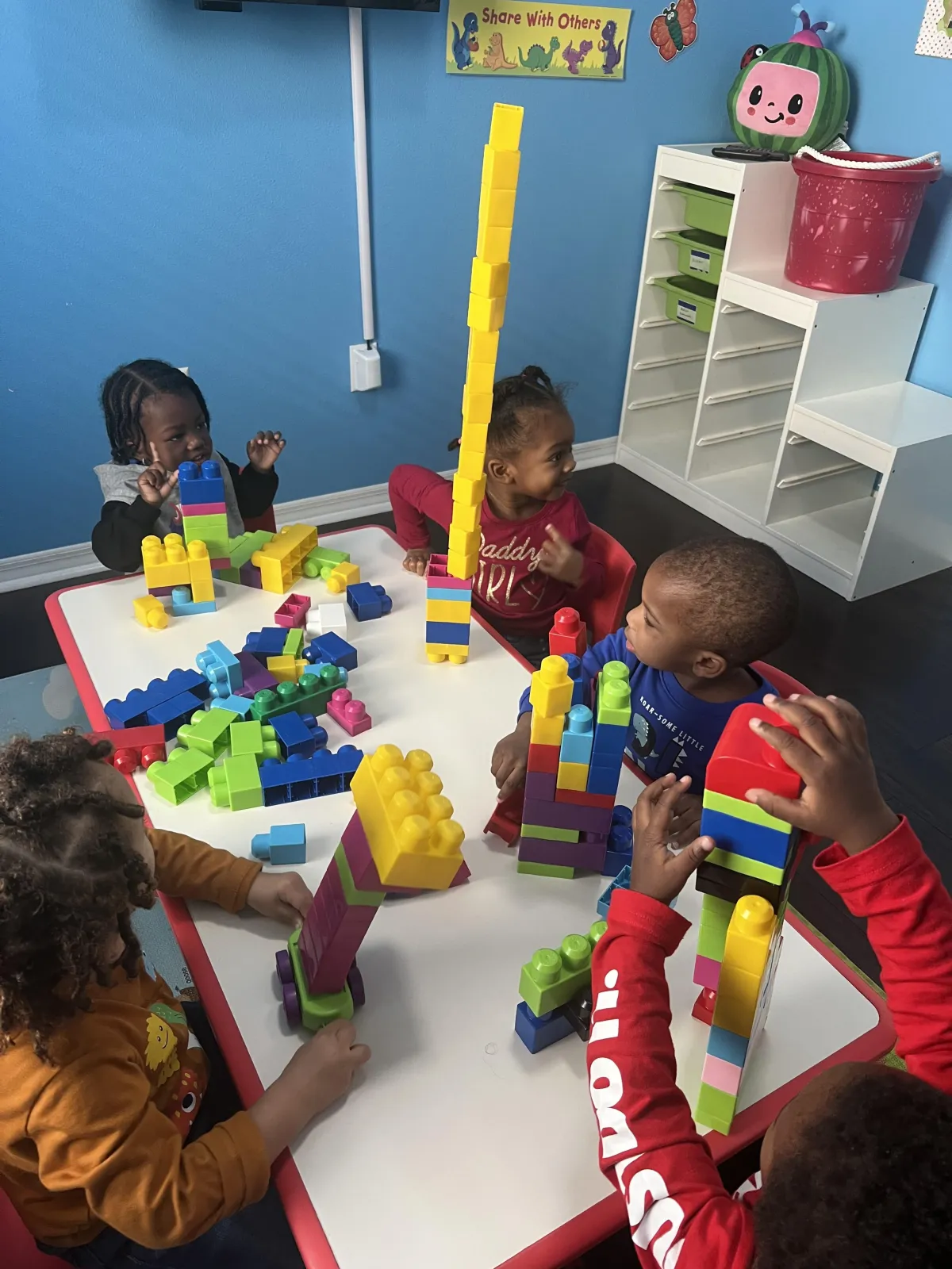 Girl watches a lesson about the alphabet on a laptop
