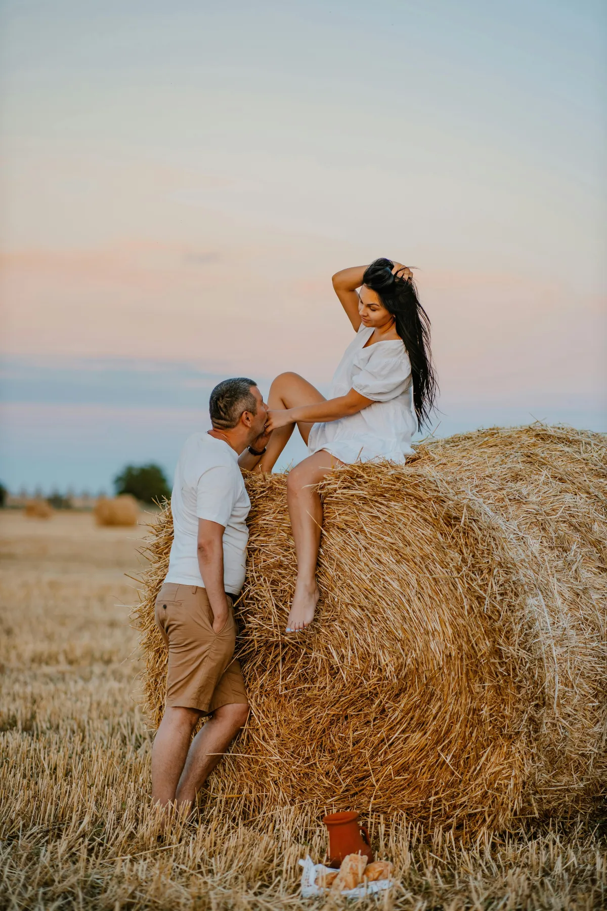 grayscale of woman and man talking each other