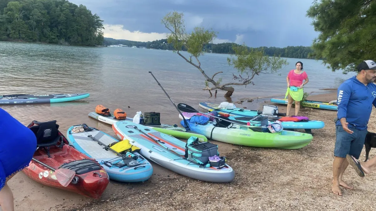 A woman in a blue dress standing in front of a stage