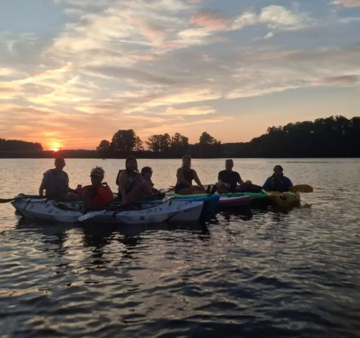 A woman in a blue dress standing in front of a stage