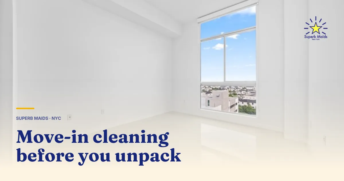 Cleaner wiping inside an empty kitchen cabinet during a move in cleaning NYC apartment turnover
