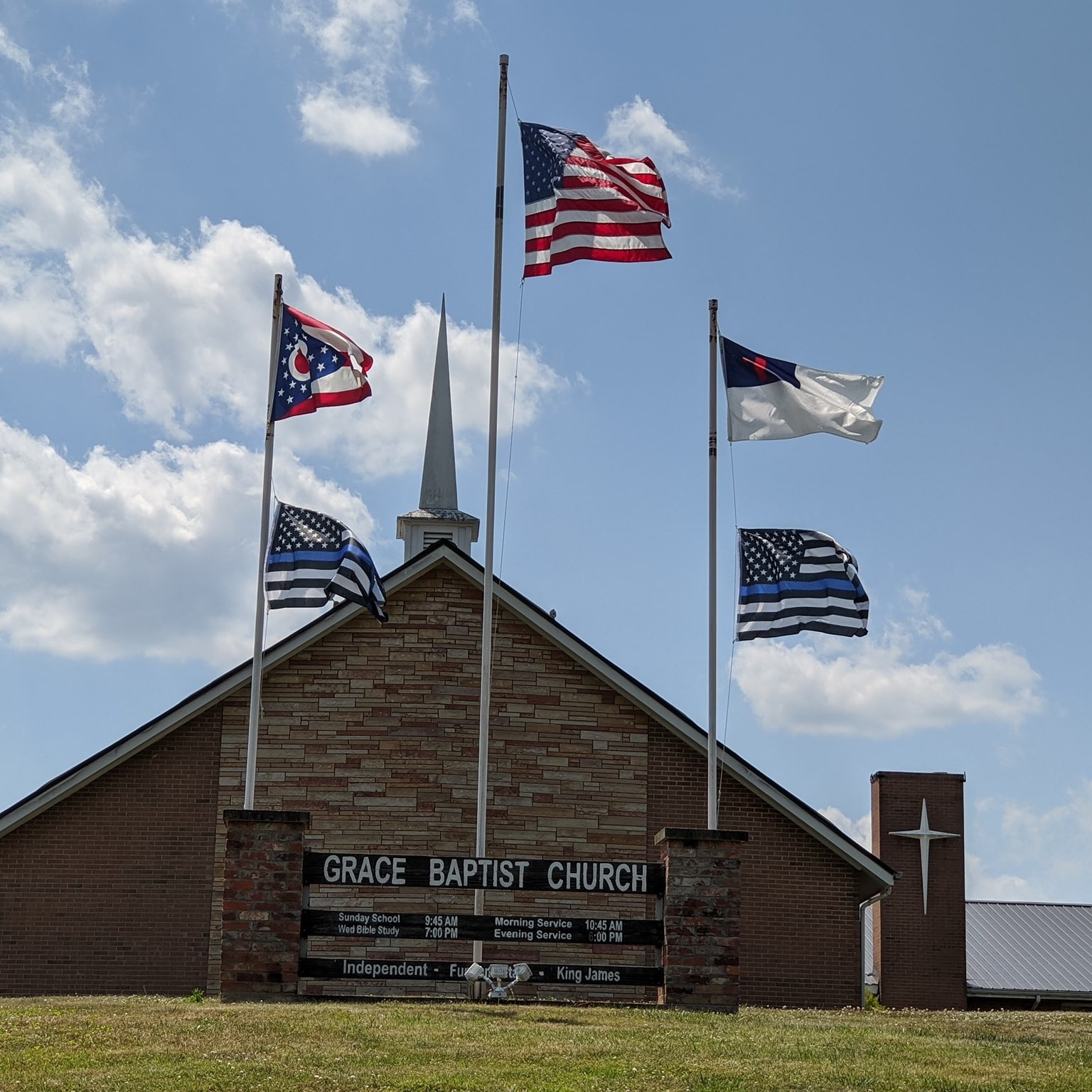 Smiling people talking together in a church lobby