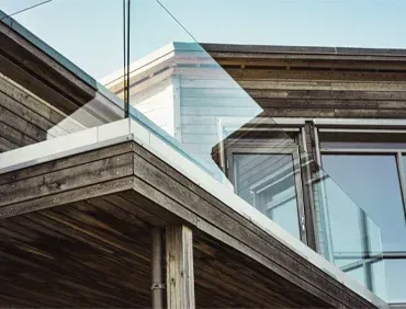 Frameless exterior glass railing for unobstructed ocean views in Naples.