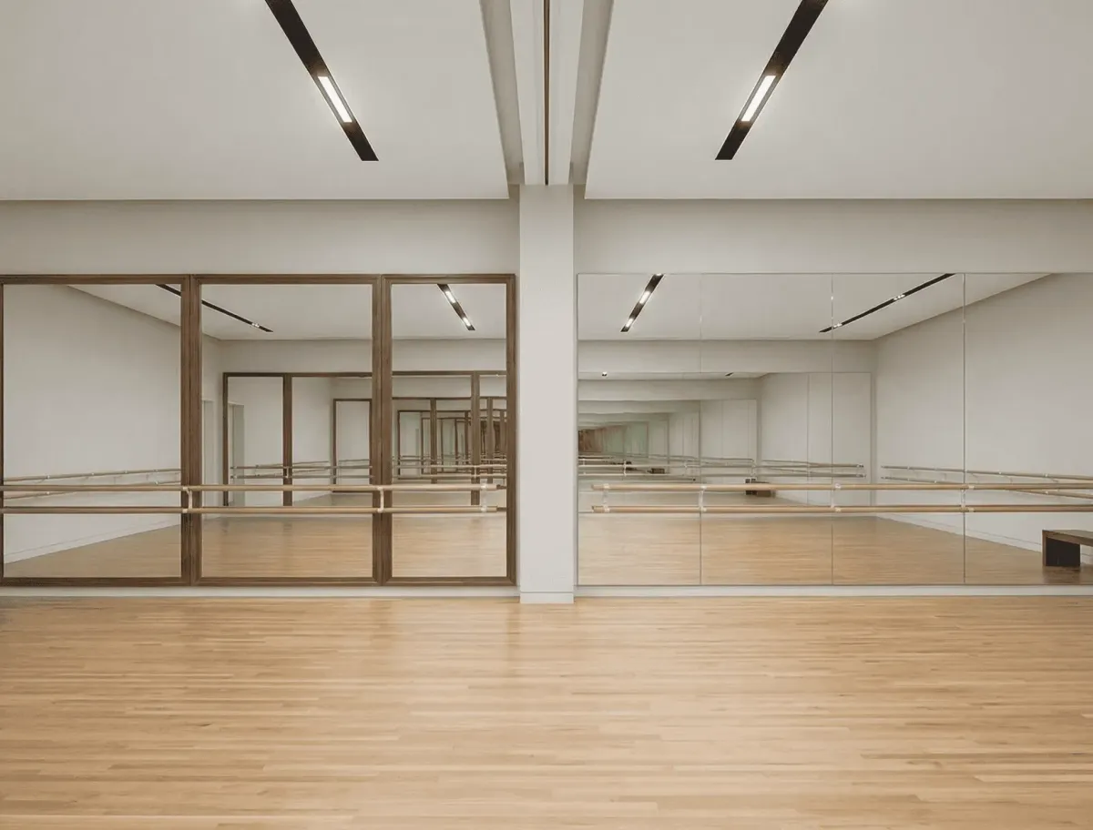 Frameless dance hall mirror for a sleek, contemporary studio aesthetic in Naples, Florida
