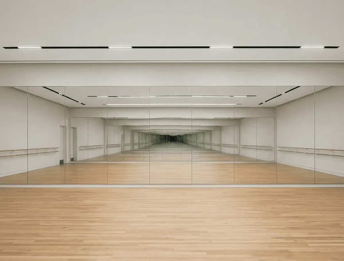 Seamless wall-to-wall dance floor mirrors providing a continuous reflection for dancers