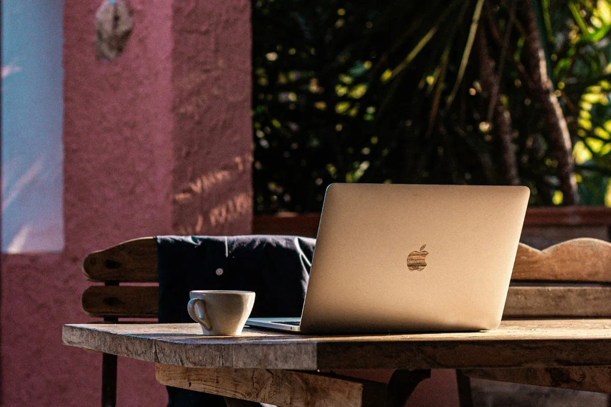 Laptop on bench, working outside