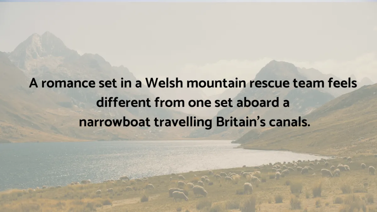 A picture of Welsh mountains, and a field of sheep representing a romance story idea set in the Welsh mountains.